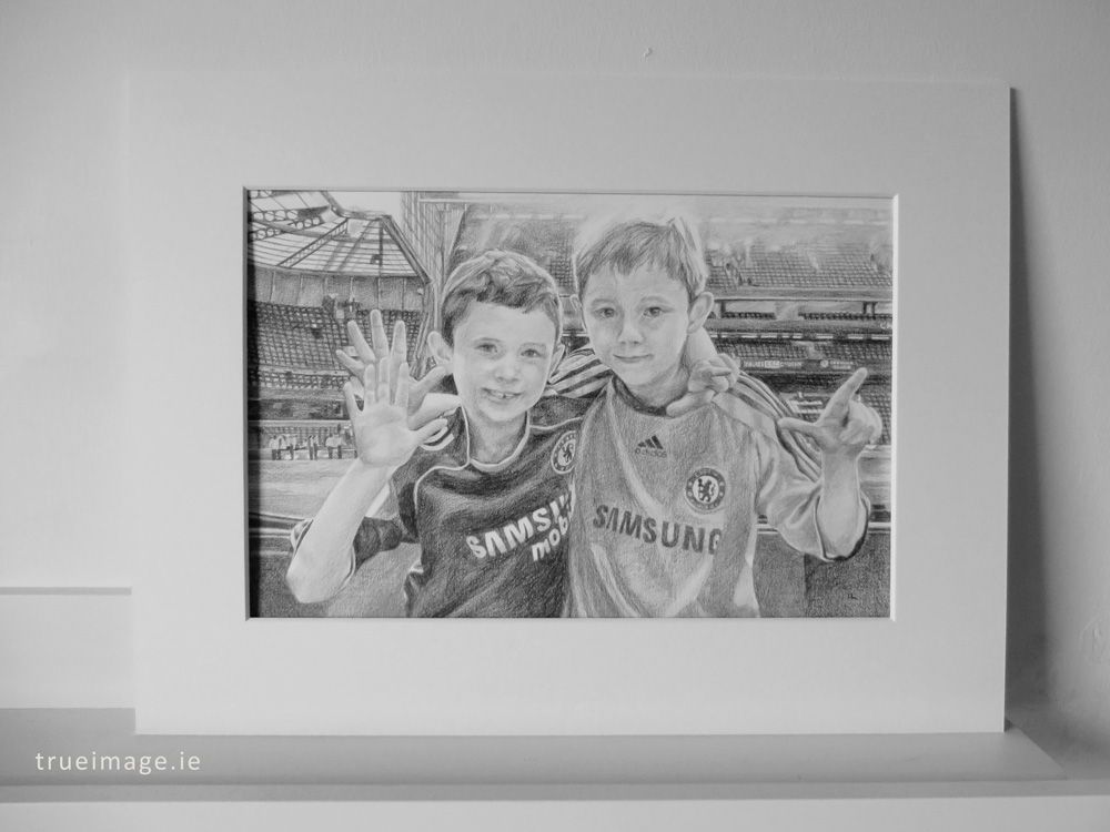 mounted pencil portrait of two boys