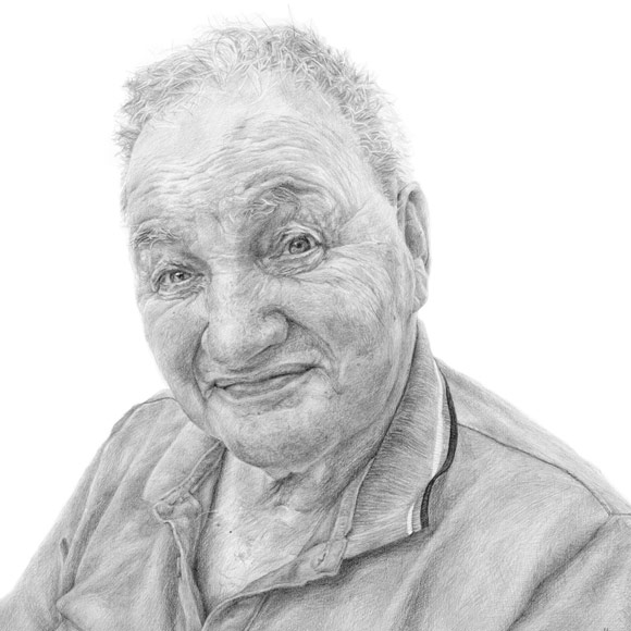 pencil portrait drawing from a photo of a man smiling by an irish portrait artist