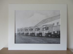 pencil drawing of trucks in a mount