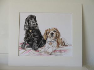 mounted portrait of two dogs