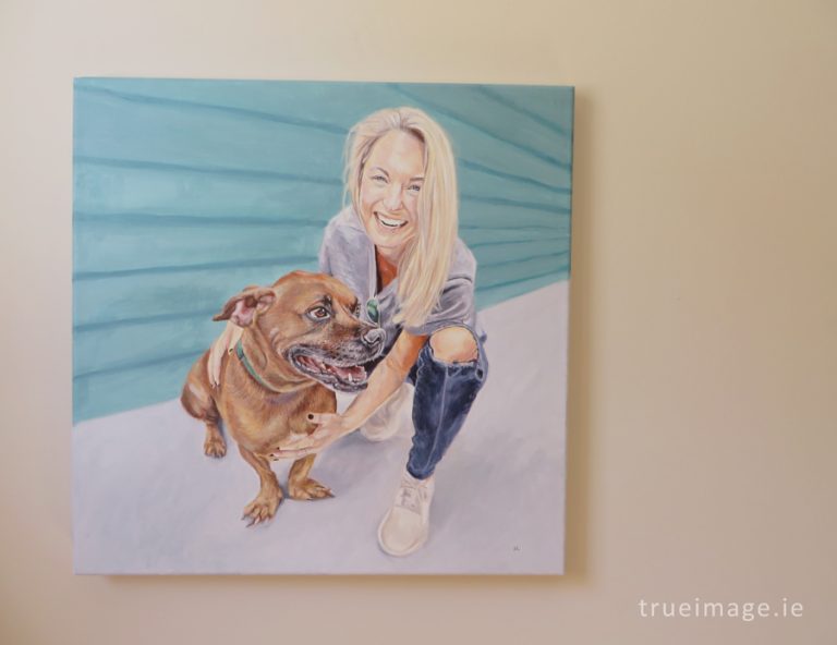 dog and owner portrait painting on a wall