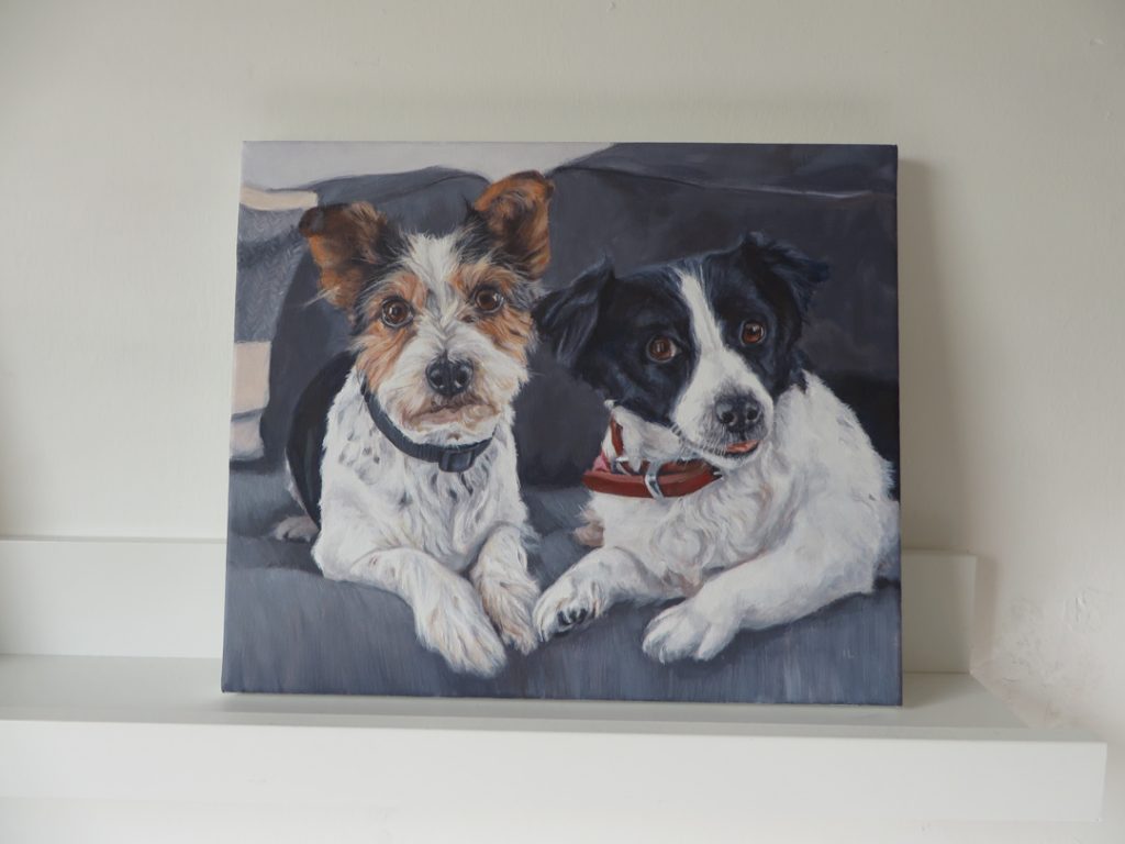 finished dogs portrait painting on a shelf