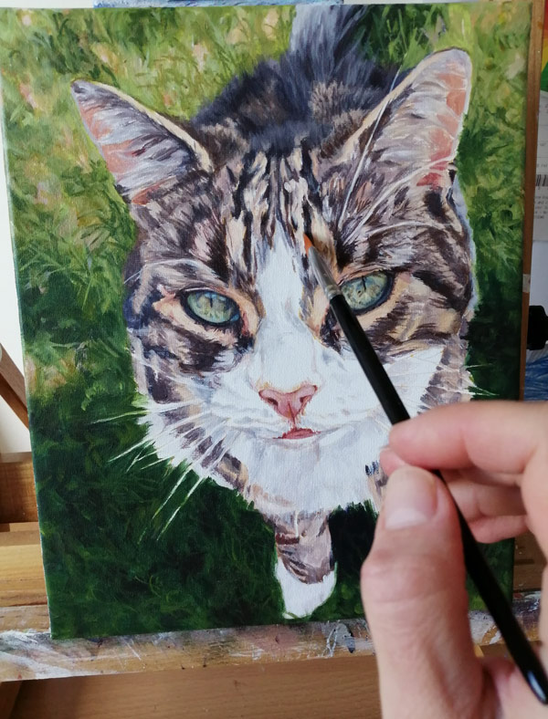 adding detail to a tabby cat portrait painting