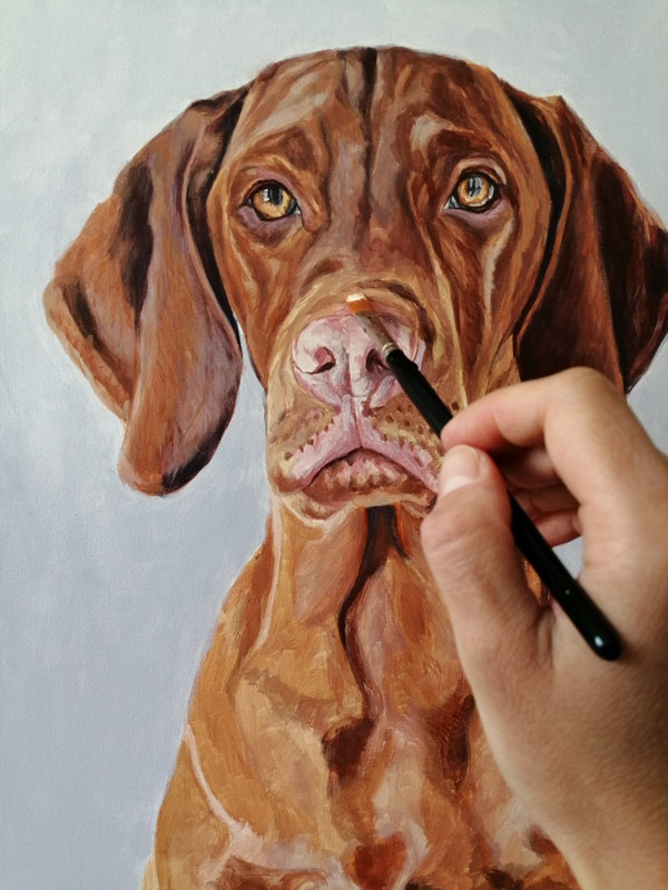 adding detail to a dog portrait painting in acrylic