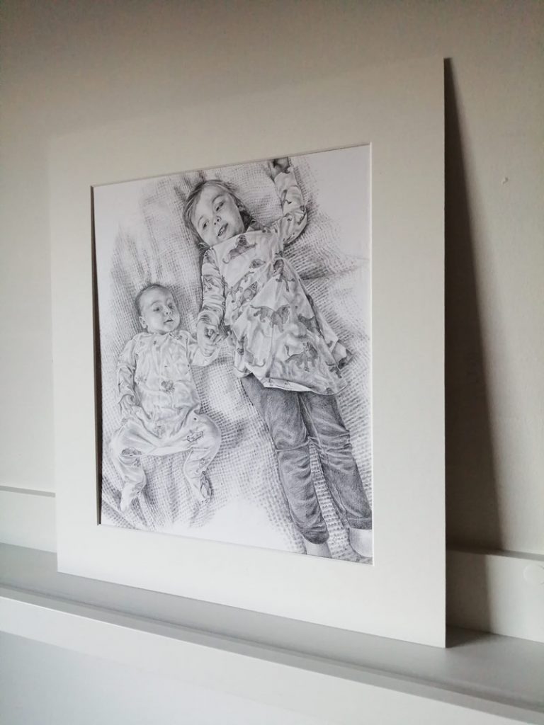 portrait drawing of two children holding hands