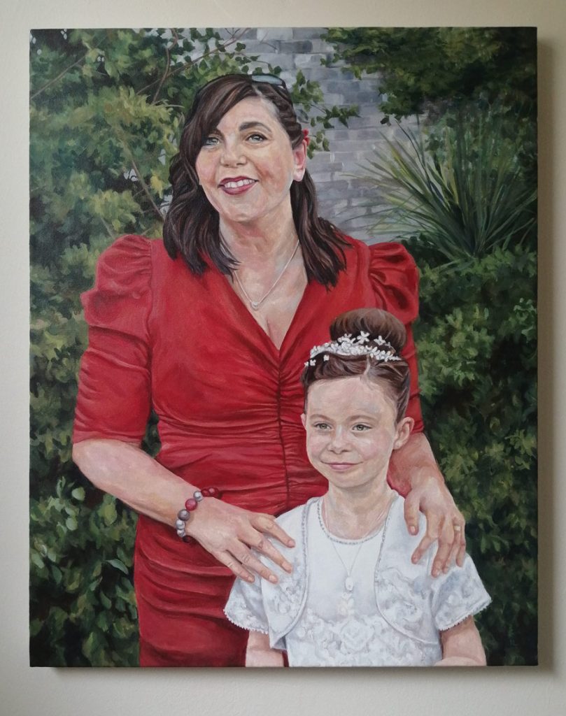 painted canvas of a mother and daughter at communion day
