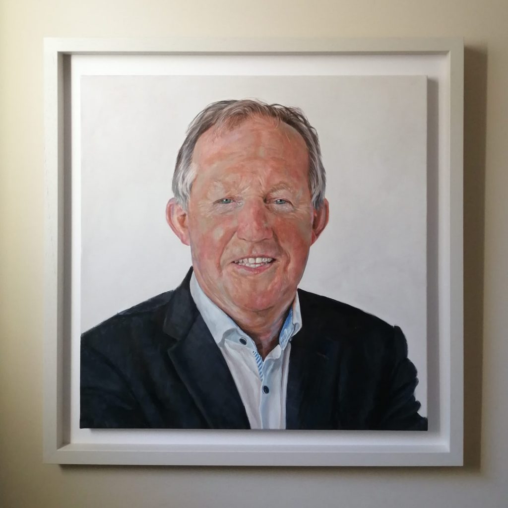 framed painting of an older smiling man