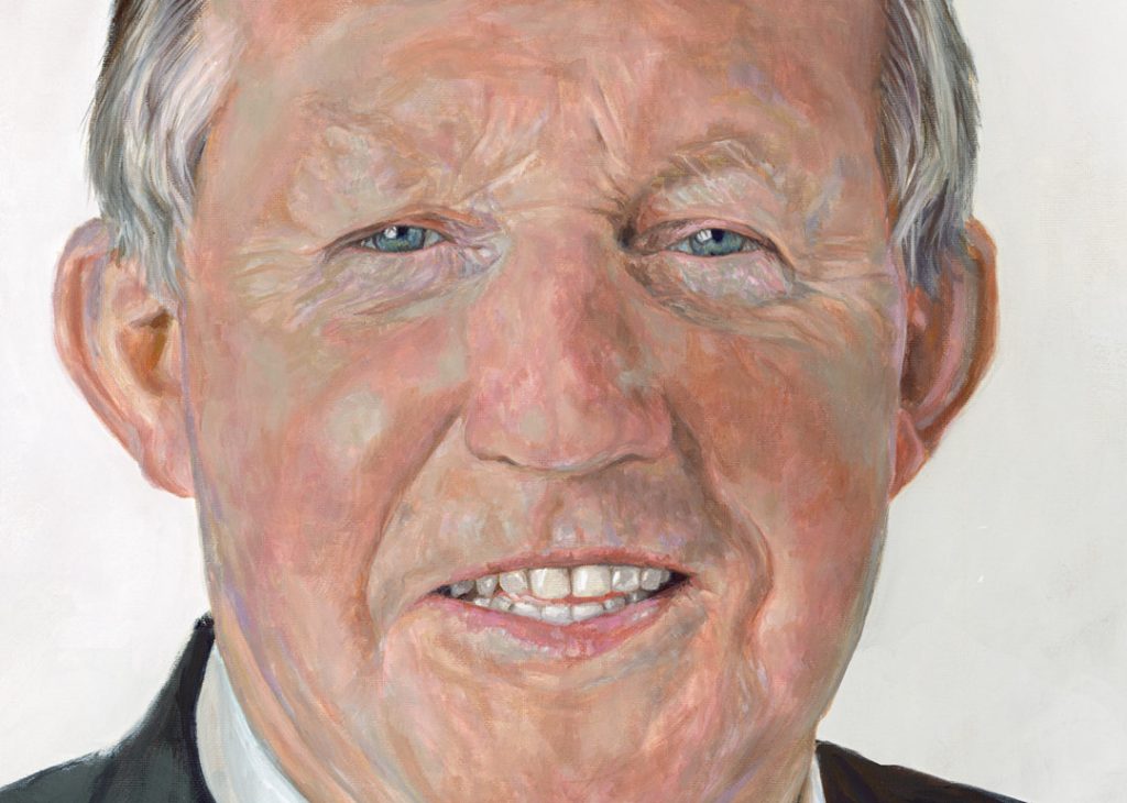close up of a painting of tom parlon smiling man