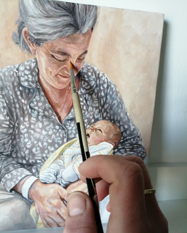 adding detail to a family portrait of a mother and baby son