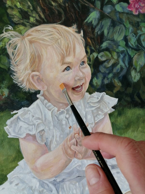 work in progress on a portrait painting of a child