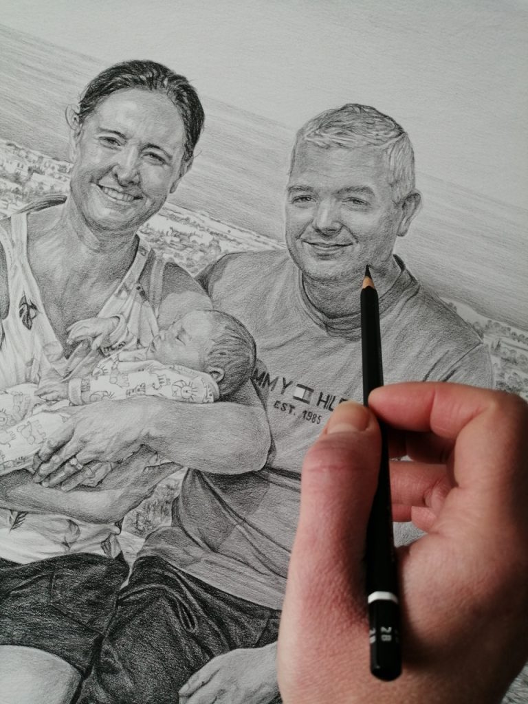 graphite pencil drawing of a couple with a baby boy