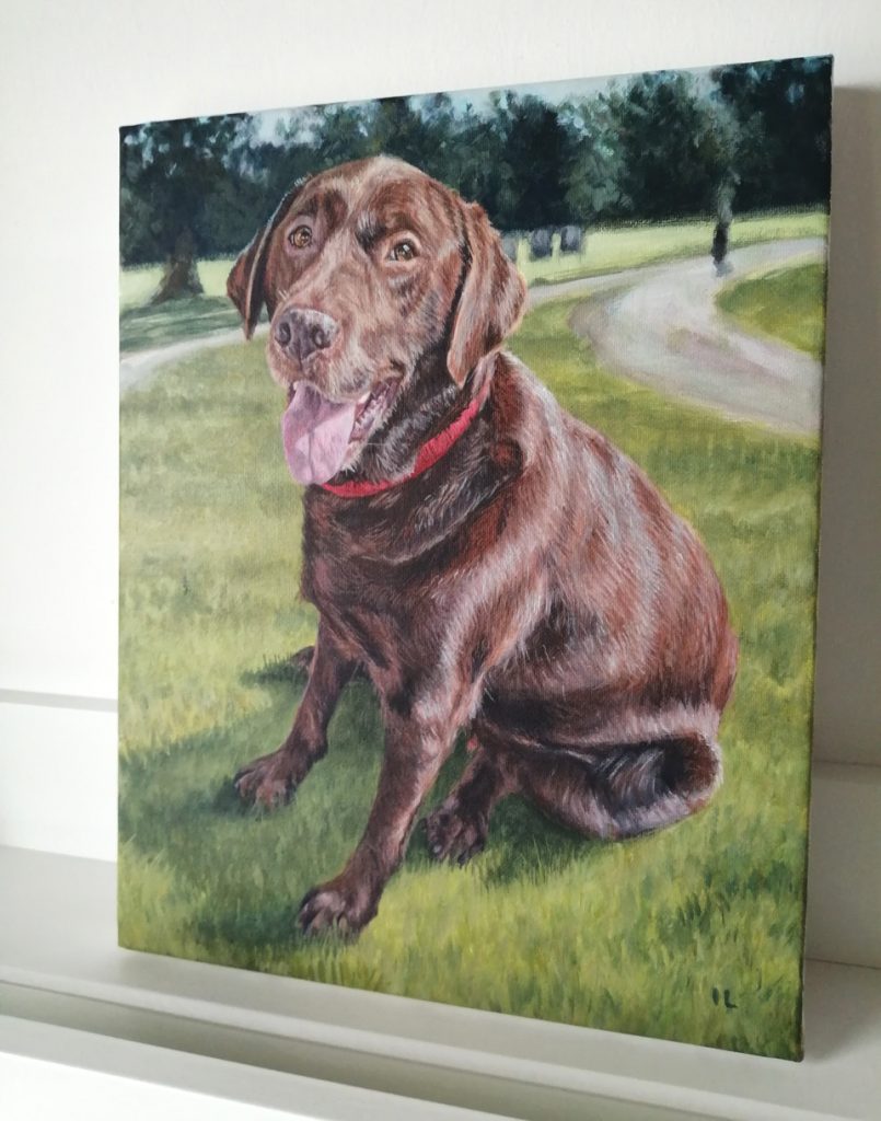 stretched canvas with an acrylic portrait painting of a retriever dog