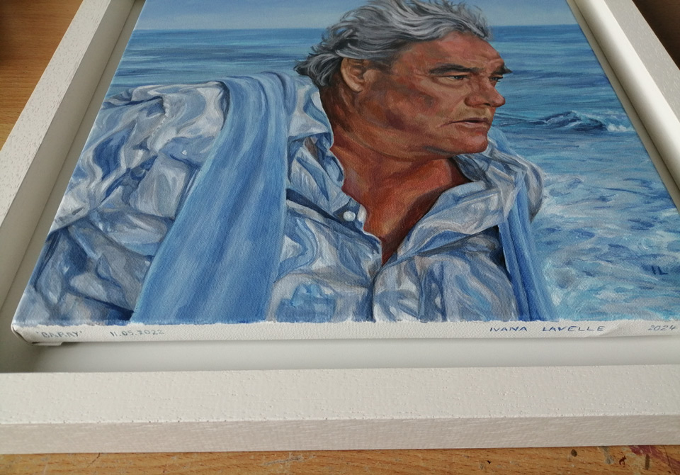 the framed and signed painting of a mature grey haired man