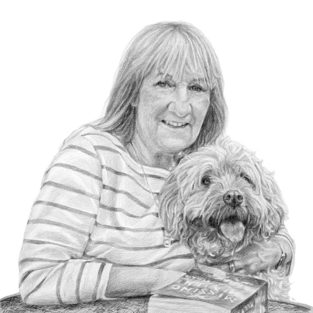 portrait of a woman and cockapoo dog smiling