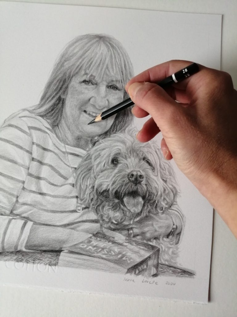 adding detail to a pencil drawing of a woman and dog