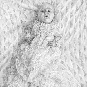 close up view of a pencil drawing of a baby boy during christening