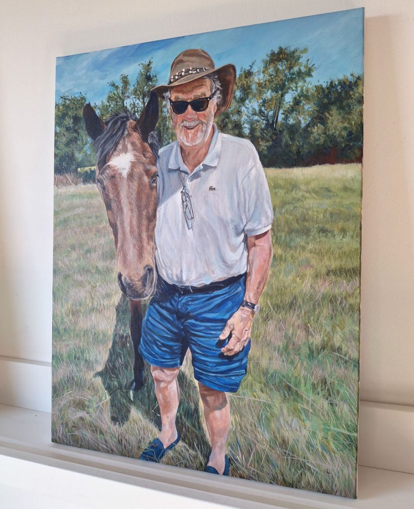finished portrait painting on canvas - man holding a horse