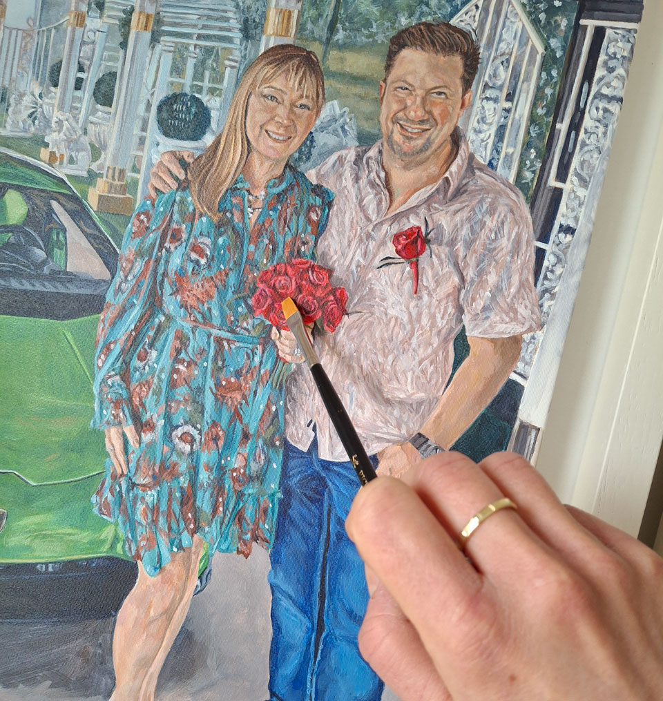 adding final detail to a wedding portrait painting from las vegas