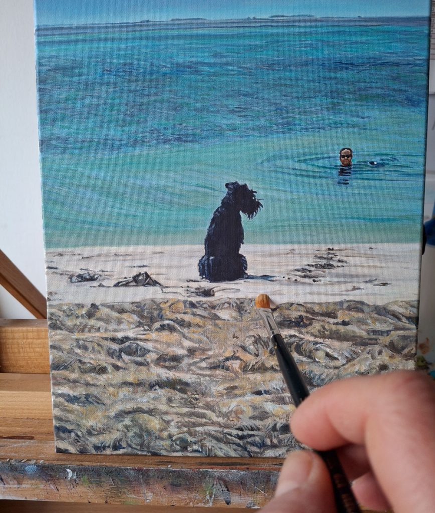 adding detail to a dog and owner seascape painting