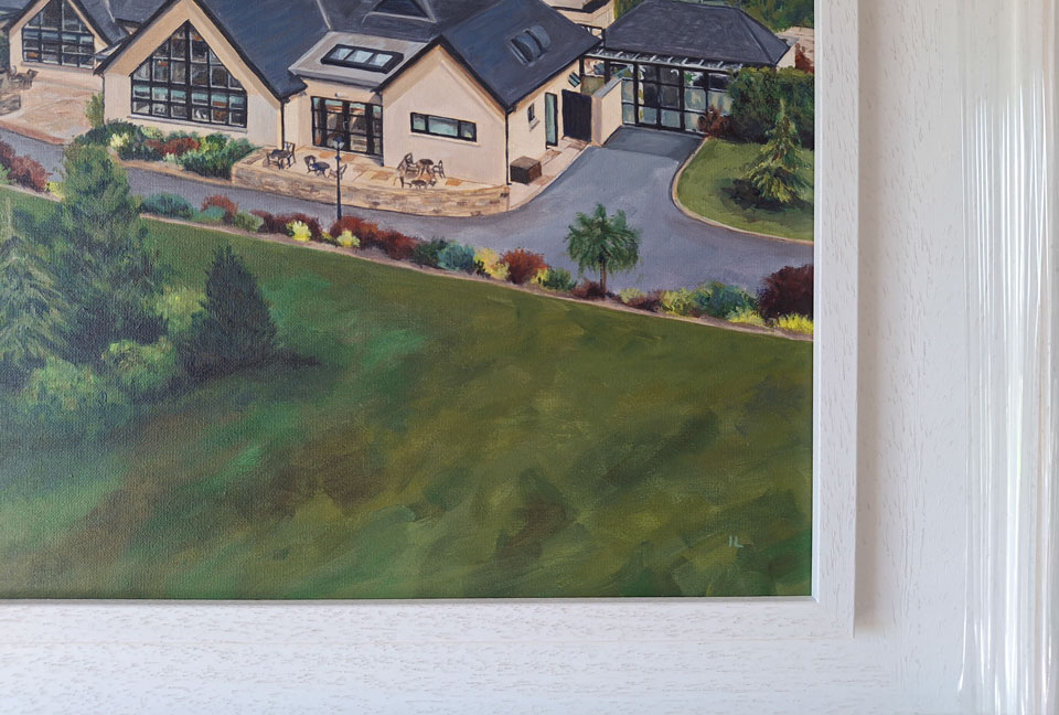 detail of the initials and frame of a hotel painting on canvas