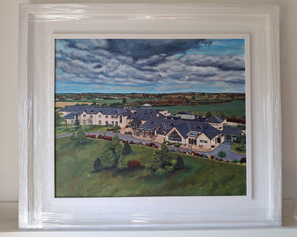 finished framed landscape painting of a hotel