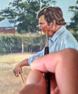 adding detail to an acrylic portrait painting of a man's profile