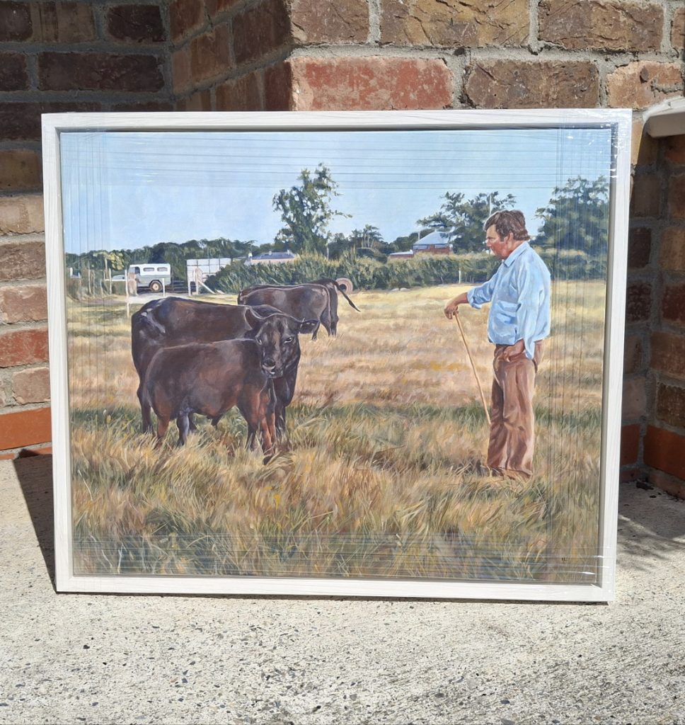 framed acrylic painting of a farmer and cattle in a field