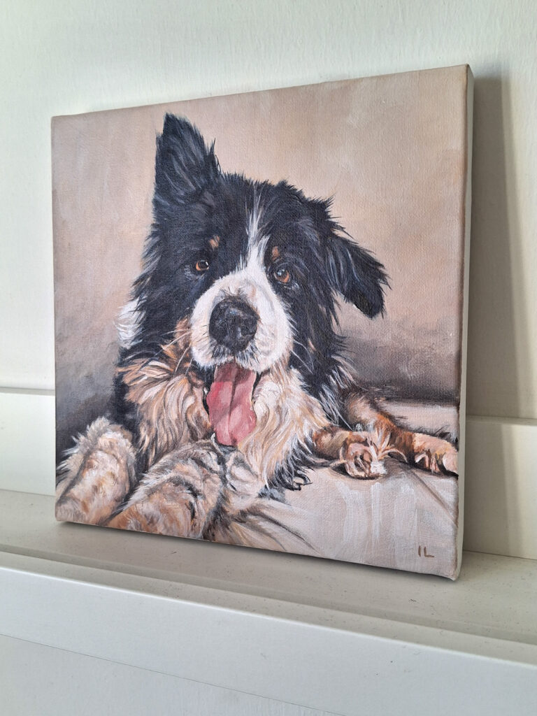 a photographs of a canvas painting of a collie dog puppy