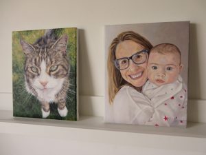 two acrylic portrait paintings from photos