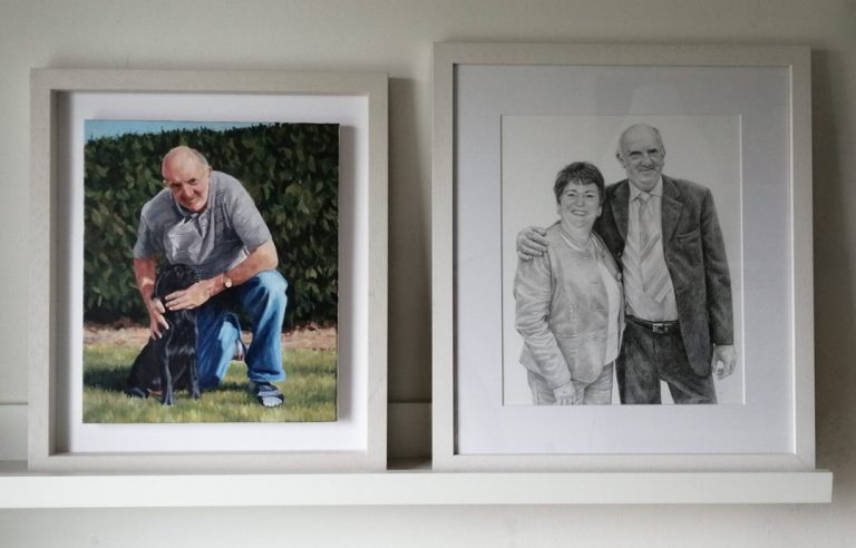 portrait drawing of a couple and painting of a man with dog