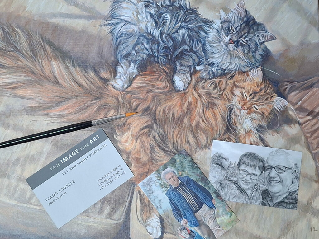 photo of a cat portrait painting with brush and artist cards