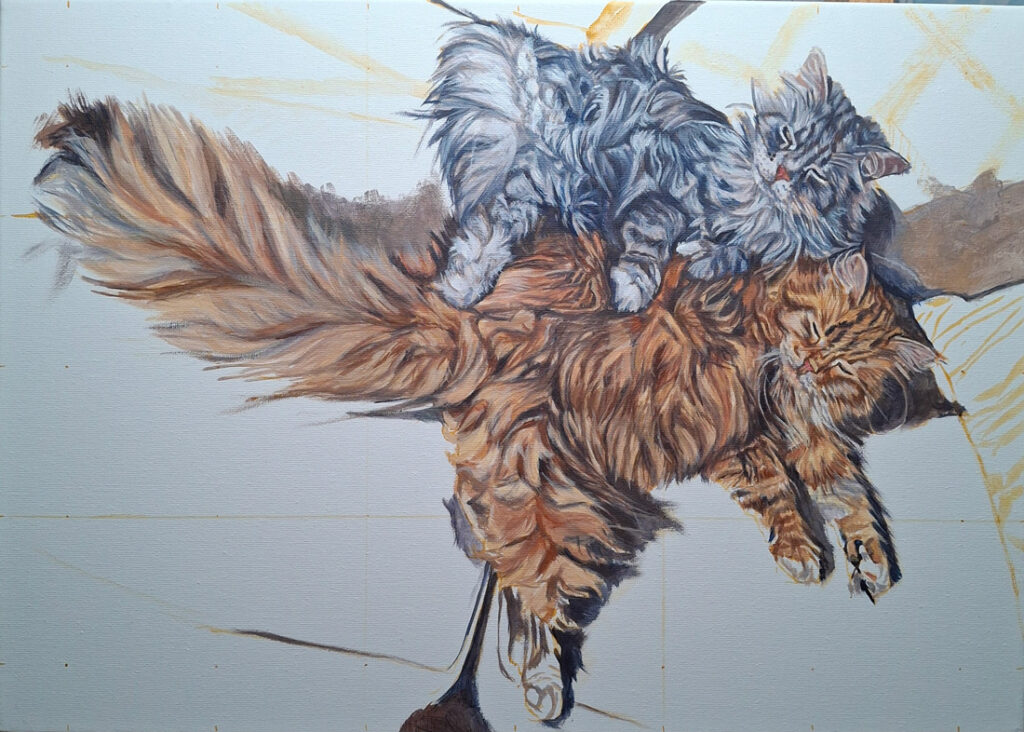 artist working on a cat portrait painting in acrylic