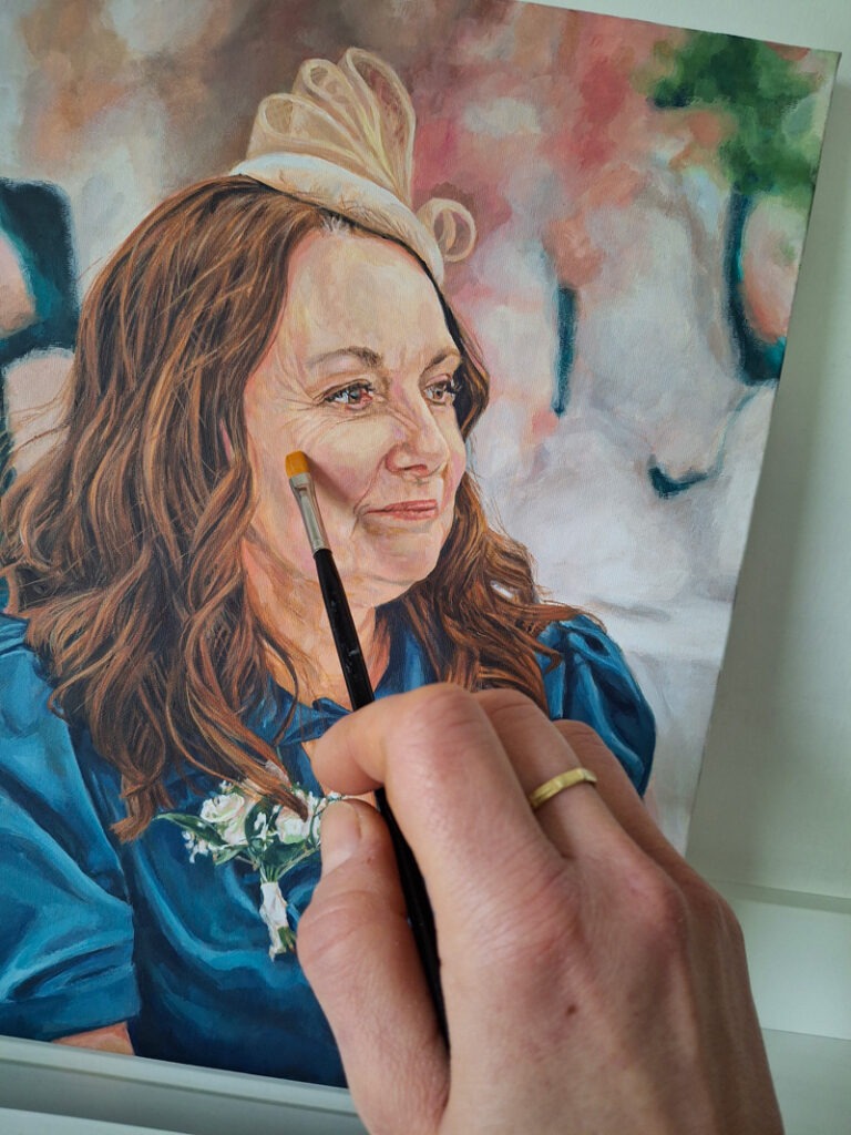 adding finishing touches to a portrait painting of a lady