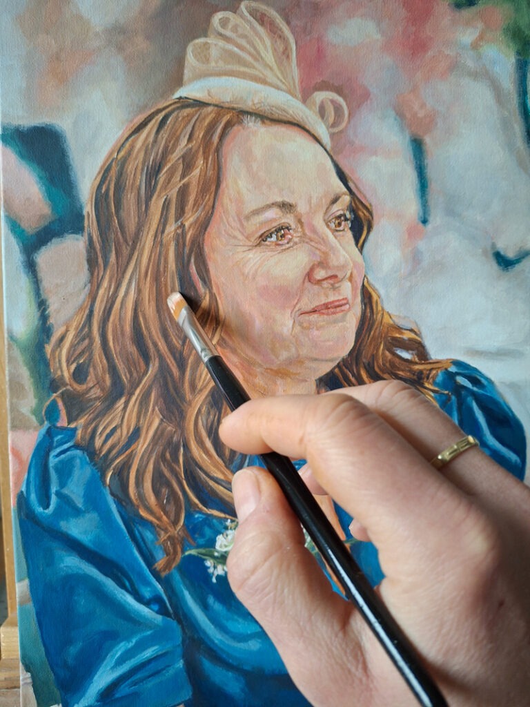 artist is adding detail to lady's hair in acrylic on canvas
