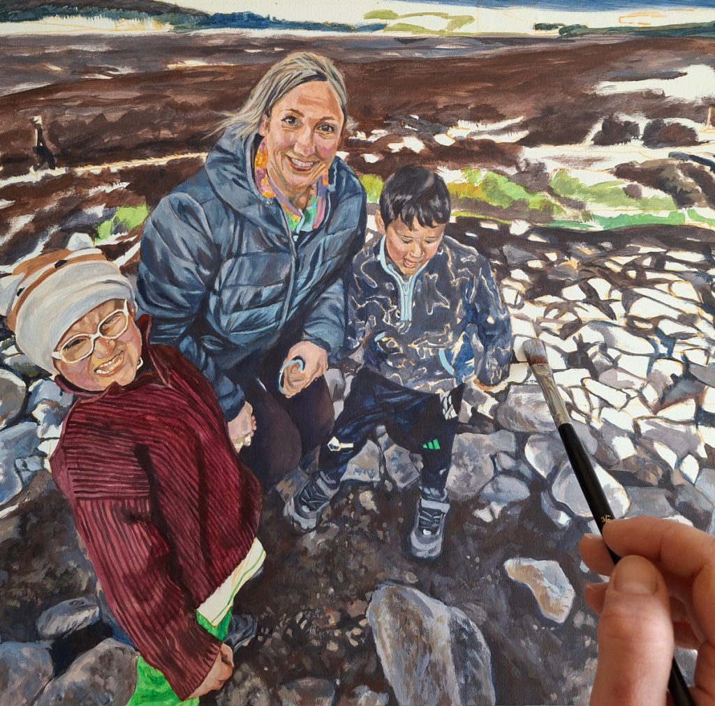 painting rocks with a flat brush in a family painting at ticknock mountain